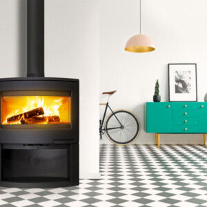 LACUNZA Bristol cast iron fireplace wood-burning with a large glowing fire, black finish, glass door and black flue in a bright modern interior, Cork, Homexpert