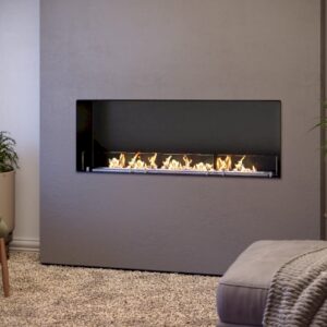 LACUNZA LUMIN 1100 S built-in bioethanol fireplace with a long horizontal flame display set into a modern grey feature wall, surrounded by contemporary furniture, indoor plants and neutral décor, Cork, Homexpert