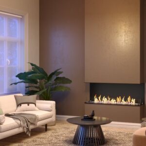 A modern living room featuring a recessed, three-sided LUMIN 1100 CLID bioethanol fireplace integrated into a brown accent pillar, casting a warm glow over a cream-colored sofa and contemporary furniture. Cork, Homexpert