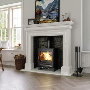 Henley Stoves Sherwood 8.2kW multi-fuel stove burning brightly inside a white traditional fireplace with large viewing window, Cork, Homexpert